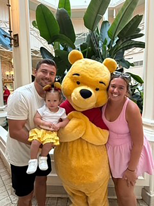 Family with Winnie the Pooh character